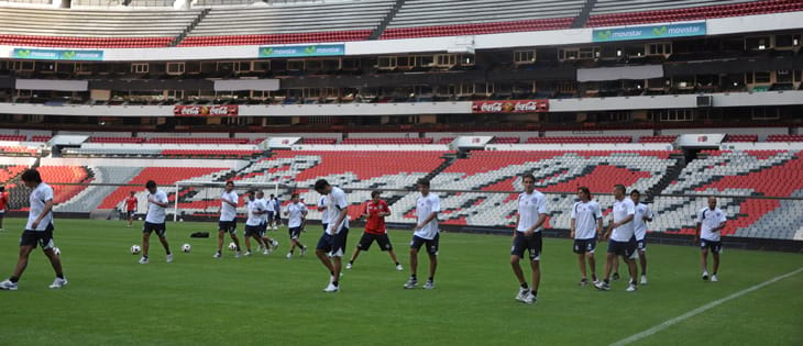Boys soccer team practicing on the Azteca Stadium in Mexico